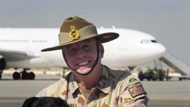 Major General John Cantwell with Sarbi before her flight to Australia.