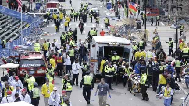 Chaotic scenes as authorities tend to the injured in Boston, where two mystery explosions went off at the end of the Boston Marathon.