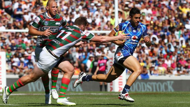 Warriors halfback Shaun Johnson makes a break against the Rabbitohs in the Auckland Nines at Eden Park.