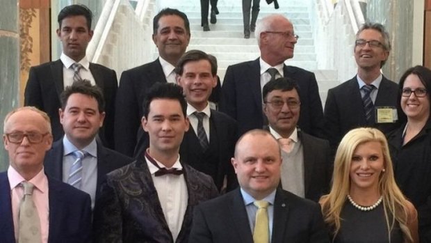 Gamble Breaux, bottom right, at Parliament House for the federal budget.