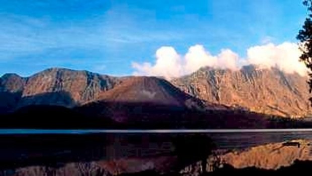 Mount Rinjani spews clouds of gas on Lombok island, east of Jakarta, Indonesia.  