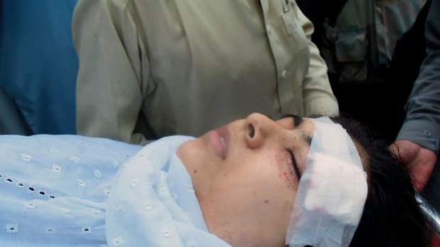 Malala is carried into hospital on a stretcher following the attack in October 2012.