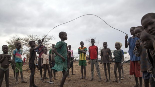 A file photo taken on April 2, 2014 shows children jumping rope in the Kule refugee camp near the Pagak Border Entry point in the Gambela Region of Ethiopia.