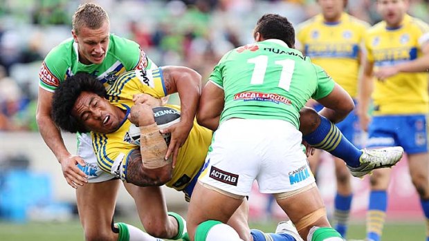 Stopped in his tracks ... Fuifui Moimoi is tackled by Jack Wighton and Josh Papalii.