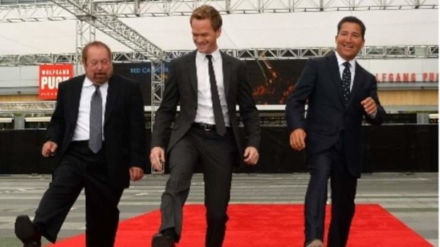 Producer Ken Ehrlich, actor Neil Patrick Harris and Chairman & CEO of the Academy of Television Arts & Sciences Bruce Rosenblum roll out the red carpet for the 65th Primetime Emmy Awards.