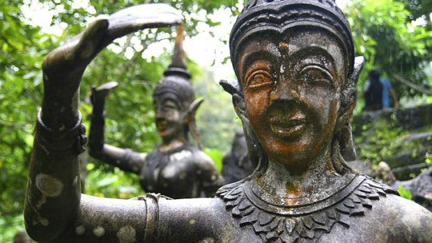 Carved peace: Stone statue in the magic garden at Ko Samui, Thailand.