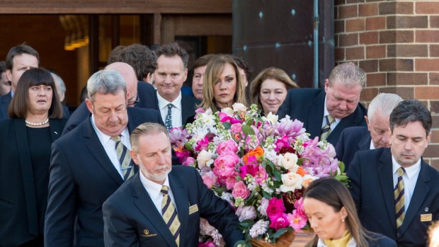 Lady Renouf's coffin is carried from St Andrew's Church on Wednesday.