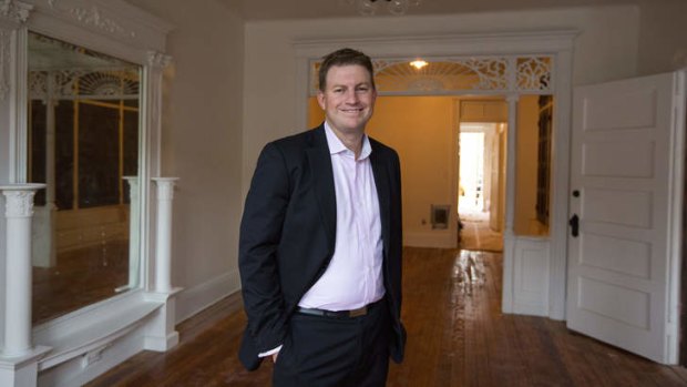 Alan Dixon, an Australian investor, stands inside a home he purchased in the Brooklyn borough of New York.