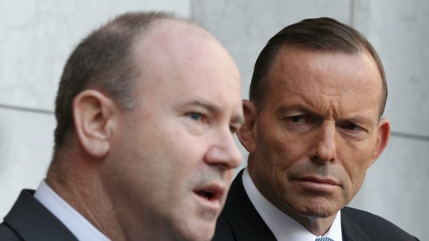 Greg Moriarty, Commonwealth Counter-Terrorism Co-ordinator, and Prime Minister Tony Abbott during a joint press conference at Parliament House in Canberra on Monday.