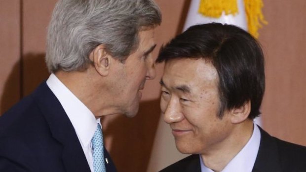 Whispers: US Secretary of State John Kerry speaks privately with South Korean Foreign Minister Yun Byung-se. At other times, Secretary Kerry and his department are counting on public broadcasts through social media.