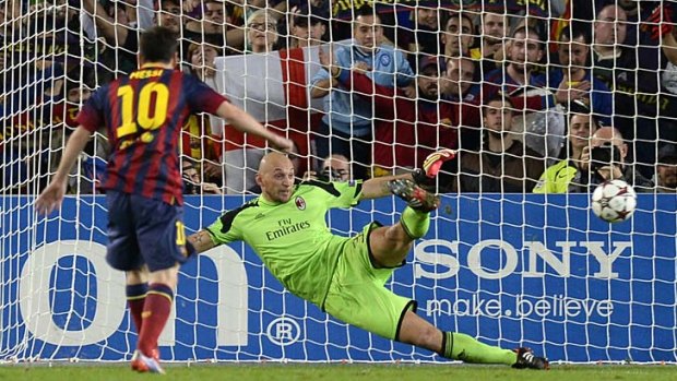 Barcelona's Argentinian forward Lionel Messi scores a penalty against AC Milan.