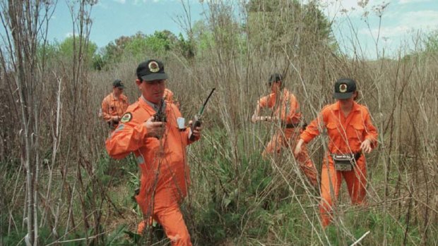The hunt is on ... State Emergency Service workers search near the area where Jessica Small vanished in 1997.