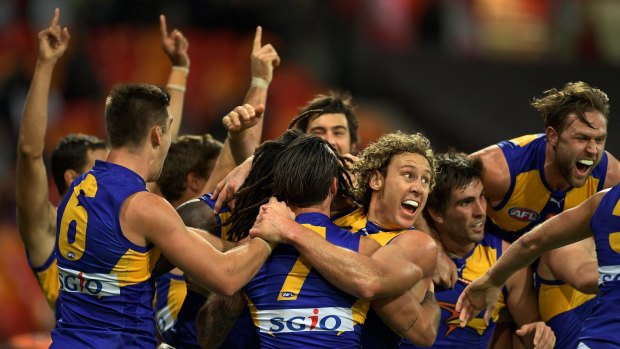 Late Eagles: West Coast players celebrate their victory over GWS Giants.