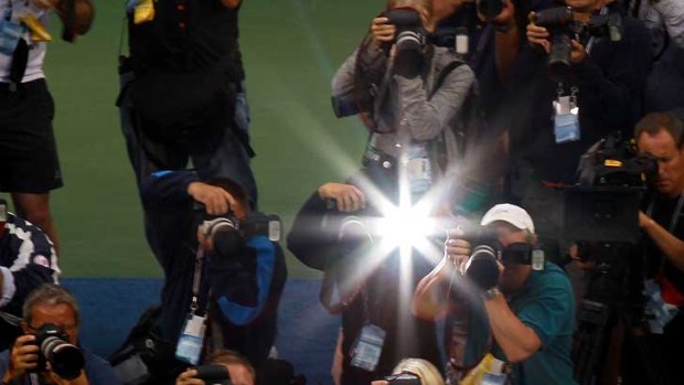 Flashes of brilliance ... Sam Stosur holds up the cup.