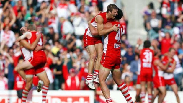 Kieren Jack and Shane Mumford lead the celebrations as Swans players all over the ground celebrate the last-gasp win over Fremantle.