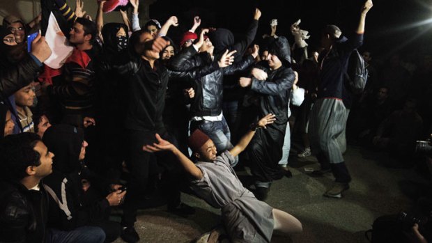 Egyptian Actvists and youth perform the Internet craze, the "Harlem Shake" in front of the Muslim Brotherhood headquarters in Cairo on February 28, 2013.