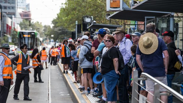Crowds waiting to catch the tram to the Grand Prix.