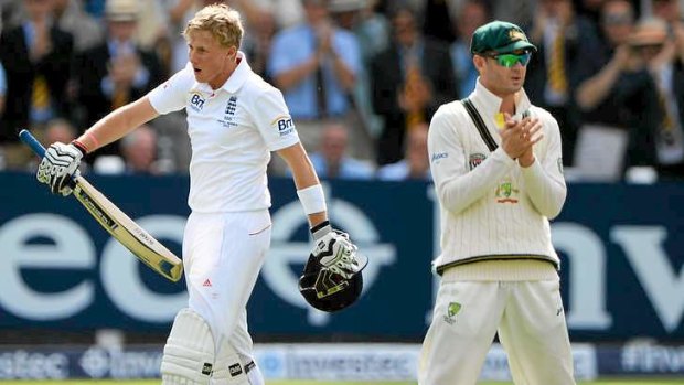 Michael Clarke can only appalud as Joe Root celebrates his century.