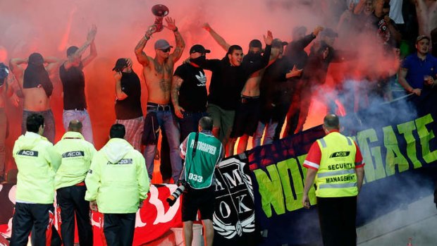 Flare-up: Some Wanderers fans lit fireworks during Saturday's match against Melbourne Victory.