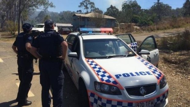 Police at the scene of the Rockhampton bushfire, believed to have been lit by  gunman.