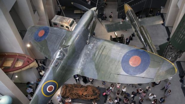 The main atrium at the Imperial War Museum  displays a Spitfire and a V2 rocket.