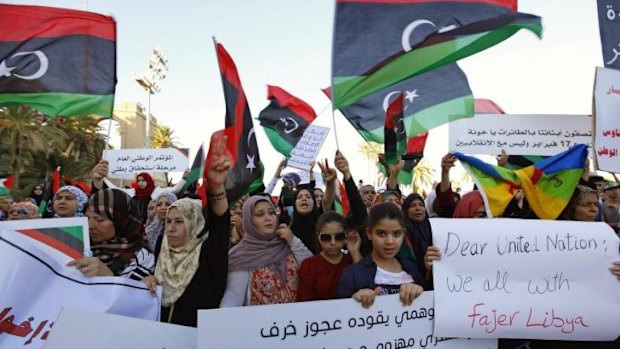 Supporters of Libya Dawn, a group of Islamist-leaning forces mainly from Misrata, demonstrate against the Libyan parliament at Martyrs' Square in Tripoli.