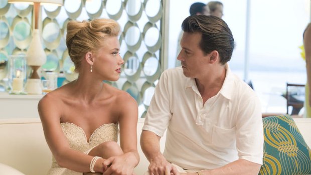 Amber Heard, left, and Johnny Depp in <i>The Rum Diary</i>.