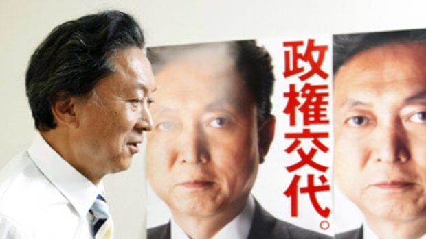 Big promises... Japan's Democratic Party leader, Yukio Hatoyama, following a historic election win. The party posters read "Change of government".