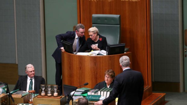 Chris cross: Mr Pyne confers with Ms Bishop as Mr Burke moves that the Speaker be referred to the privileges committee over her biased rulings.