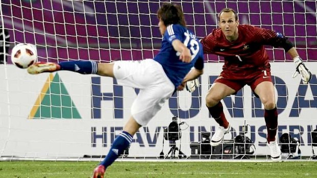 Heartbreaker: Japan's Tadanari Lee shoots to score against Australia's goalkeeper Mark Schwarzer during extra-time of their 2011 Asian Cup final.