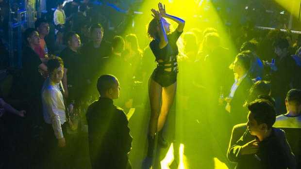 A dancer performers her routine on opening night at Linx, a new nightclub on Huaihai Road.