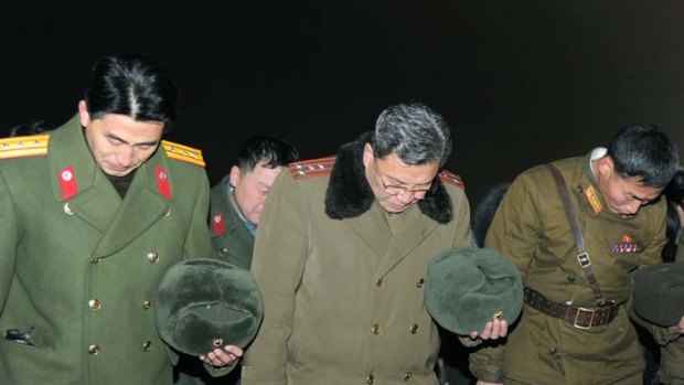 Lying in state ... North Korean soldier in Pyongyang mourn their leader.