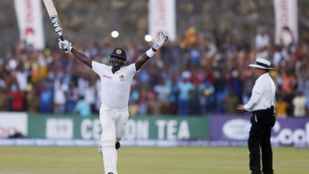 Sri Lanka skipper Angelo Matthews celebrates after his team defeated Pakistan by seven wickets in the first Test.