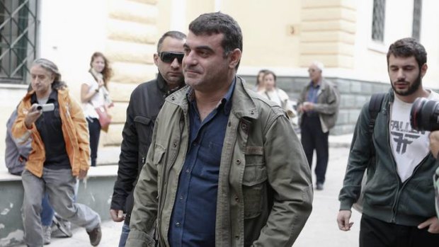 Costas Vaxevanis arrives at a court in Athens on the first day of his trial over the publication of the names of more than 2000 wealthy Greeks with Swiss bank accounts.