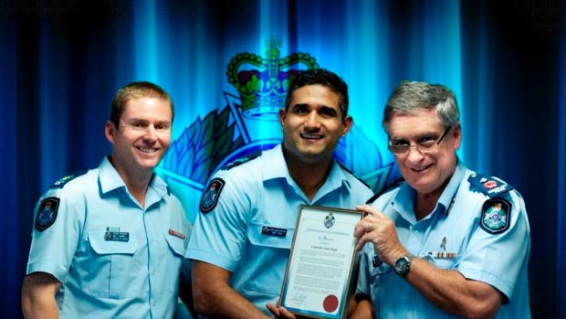 Constable Amit Singh (middle) was awarded a police bravery commendation.