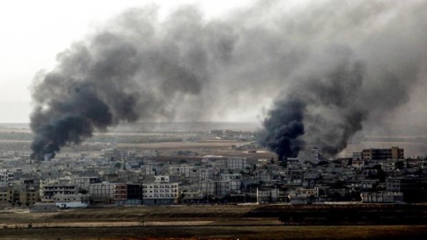 Conflict zone: Smoke rises from parts of Kobane bombed by US and Saudi warplanes.