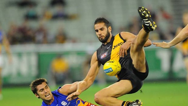 Richmond's Bachar Houli throws himself into the game