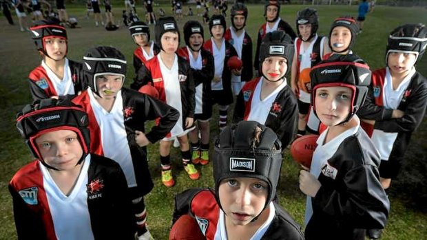 Young players at AJAX Junior Football Club must wear helmets and mouthguards.