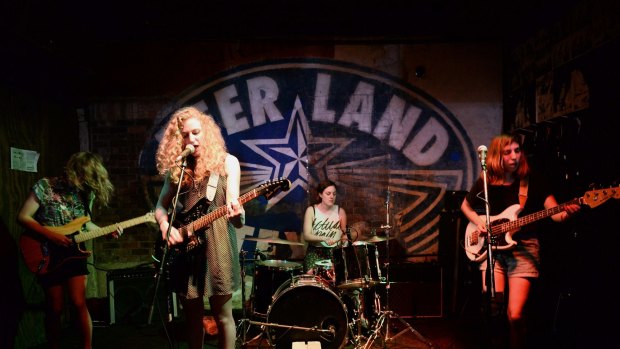 A band performs onstage at Beerland in Austin, Texas. 