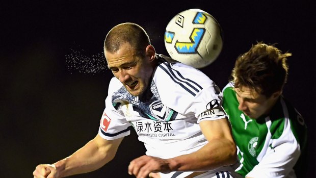 Melbourne Victory’s Carl Valeri heads the ball during the FFA Cup quarter-final match against Bentleigh Greens. 