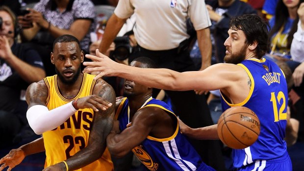 Out of the rotation: Andrew Bogut defends LeBron James during game three of the NBA finals.