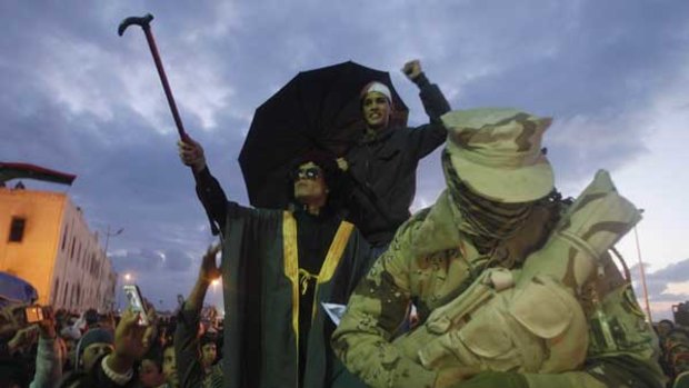 Student Hussein al-Badry delights the crowd with his impersonation of Libyan leader Muammar Gaddafi in a protest against Colonel Gaddafi in Benghazi on the weekend.