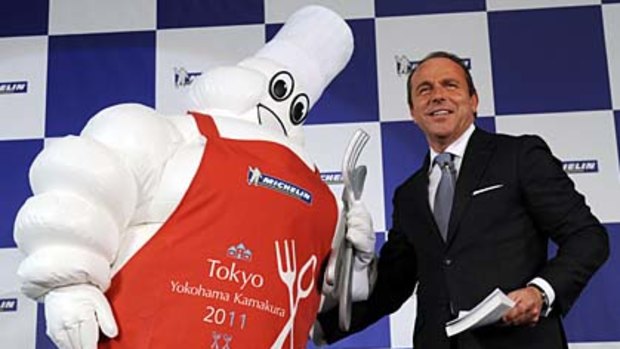 Jean-Luc Naret (R), director of the Michelin Guides, introduces the company's new editiion of the Michelin guide for Tokyo.