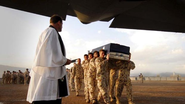 "A little better is everything to Afghans" - Veteran James Brown. Above, the Bearer Party carry the casket of Corporal Mathew Hopkins who died while conducting offensive operations in Oruzgan Province, southern Afghanistan.