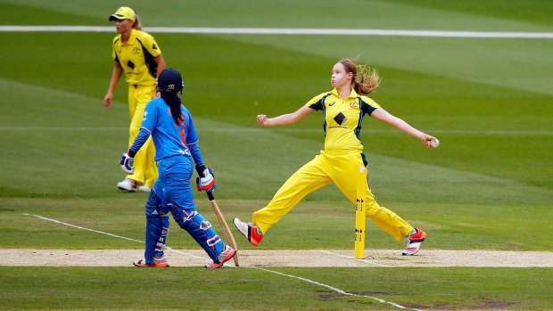 Keeping pace: Lauren Cheatle bowls during the match against India.