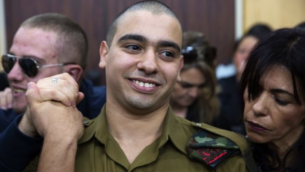 Sergeant Elor Azaria waits with his parents for the verdict inside the military court in Tel Aviv.