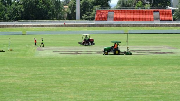 Work being conducted on the  Manuka Oval cricket pitch area on Tuesday.