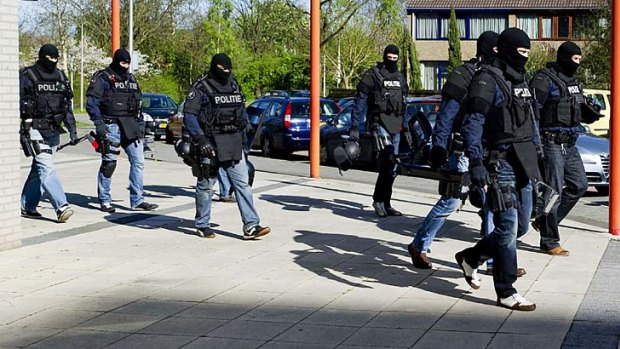 Keeping guard ... police walk the streets of Alphen aan den Rijn.
