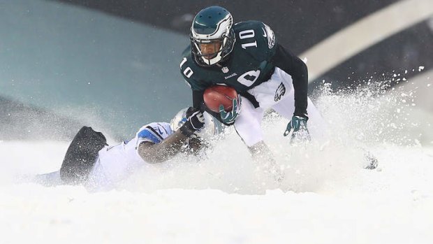 Camouflaged Lion: Jeremy Ross of the Detroit Lions can barely be seen as he tackles DeSean Jackson of the Philadelphia Eagles.