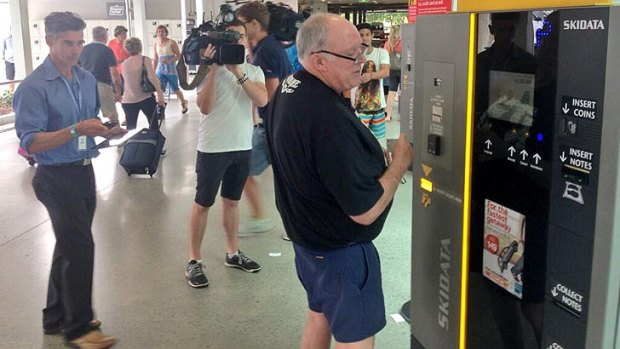 John Chardon arrives at Brisbane airport after an overseas business trip.